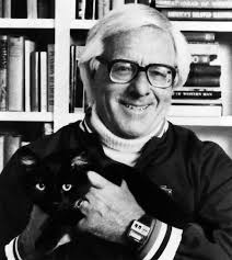 Black-and-white photo of Ray Bradbury with glasses smiling while holding a black cat, with bookshelves in the background.
